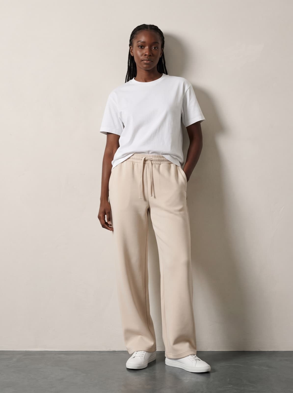 Chelsea Joggers in beige worn with a plain white tee, showing the wide thigh