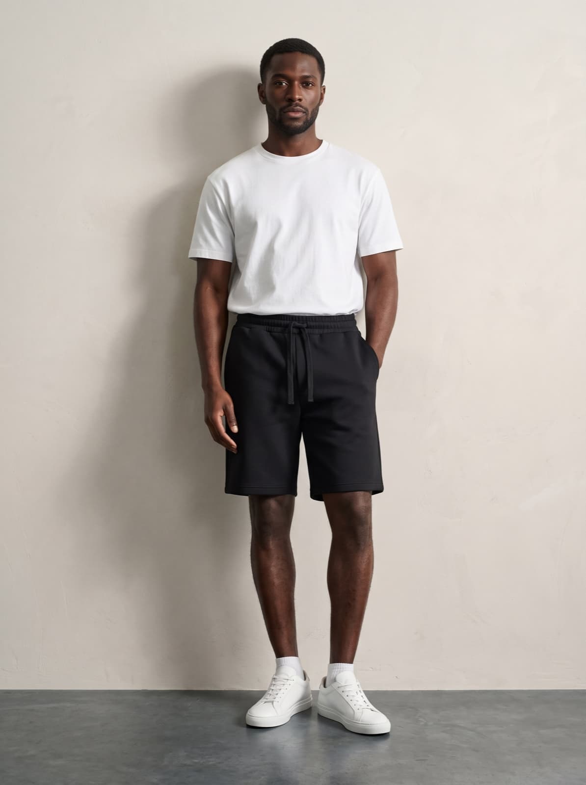 Chelsea Shorts in black worn with a plain white tee