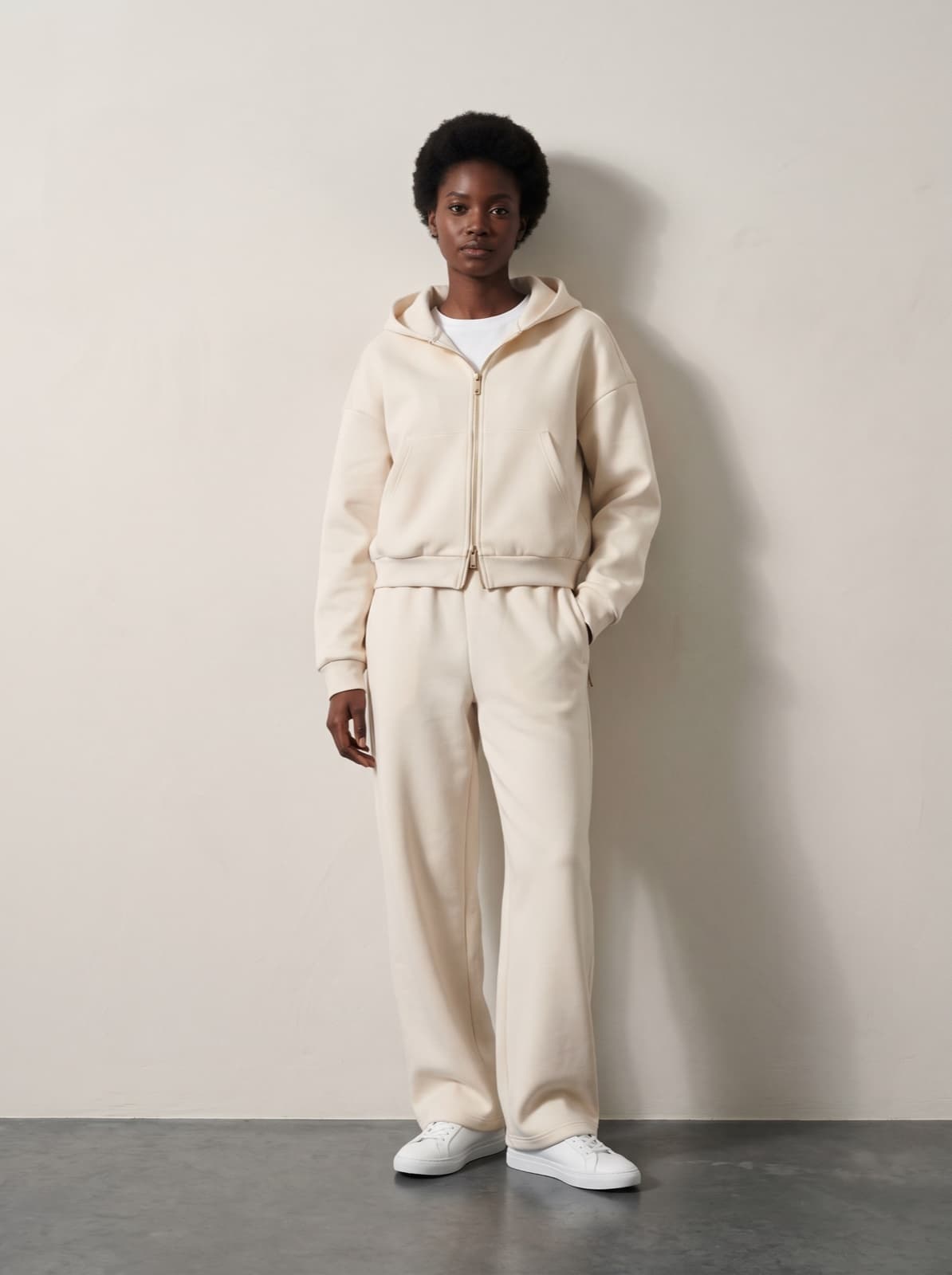 Chelsea Joggers in cream worn as a complete set with the matching Chelsea Zip Hoodie, front on