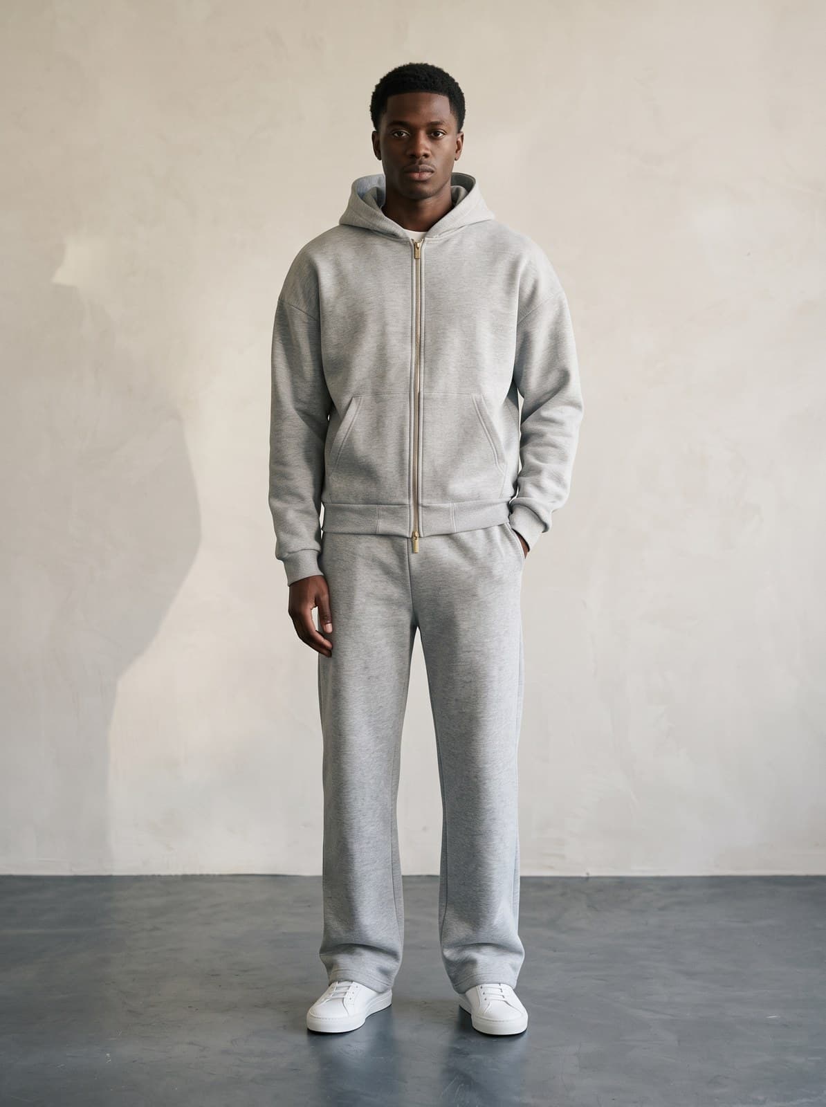 Kensington Zip Hoodie in grey marl worn with matching trousers, front on